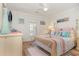 Cozy bedroom with a neutral color scheme, a decorative comforter, and wooden floors at 1644 South Waccamaw Dr., Murrells Inlet, SC 29576