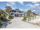 Inviting exterior view of a stylish home with a well-maintained yard and white picket fence at 1644 South Waccamaw Dr., Murrells Inlet, SC 29576
