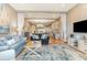Spacious living room with wood floors, exposed beams, and an open layout design at 1644 South Waccamaw Dr., Murrells Inlet, SC 29576