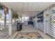Spacious outdoor patio with a bar, grill, and decorative details for entertaining and enjoyment at 1644 South Waccamaw Dr., Murrells Inlet, SC 29576