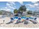 Beautiful pool area with lounge chairs, palm trees, and inviting blue water under a sunny sky at 1644 South Waccamaw Dr., Murrells Inlet, SC 29576