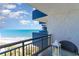 Relaxing balcony view overlooking the sandy beach and ocean, complete with a charming table setting at 2001 S Ocean Blvd. # 1505, Myrtle Beach, SC 29577