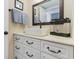 Bathroom showcasing a sleek white sink, vanity with dark hardware, and mirror at 2001 S Ocean Blvd. # 1505, Myrtle Beach, SC 29577