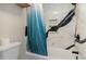 Modern bathroom with a combination shower and tub featuring a marble-patterned wall at 2001 S Ocean Blvd. # 1505, Myrtle Beach, SC 29577