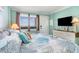 Cozy bedroom with nautical themed decor and a large screen TV on the wall at 2001 S Ocean Blvd. # 1505, Myrtle Beach, SC 29577