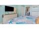 Bedroom displaying a queen-size bed, dresser, and a flat-screen TV on the wall at 2001 S Ocean Blvd. # 1505, Myrtle Beach, SC 29577