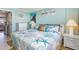 Bright bedroom featuring coastal decor, a queen-size bed, and wicker furniture at 2001 S Ocean Blvd. # 1505, Myrtle Beach, SC 29577