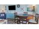 Comfortable dining area with seating for four, nautical-themed decor, and a view of the living room at 2001 S Ocean Blvd. # 1505, Myrtle Beach, SC 29577