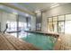 Relaxing indoor pool area with a brick surround and easy access ladder for a refreshing swim at 2001 S Ocean Blvd. # 1505, Myrtle Beach, SC 29577