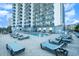 Outdoor pool featuring lounge seating, building views, and resort amenities at 2001 S Ocean Blvd. # 1505, Myrtle Beach, SC 29577