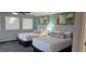 Comfortable bedroom with two beds, modern decor, and a bright, airy ambiance at 218 Double Eagle Dr., Surfside Beach, SC 29575
