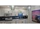 Well-equipped kitchen featuring sleek white cabinets, stylish lighting, and modern appliances at 218 Double Eagle Dr., Surfside Beach, SC 29575