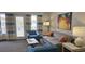 Comfortable living room with a cozy sofa, armchairs, and a balcony with lovely outdoor views at 218 Double Eagle Dr., Surfside Beach, SC 29575