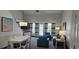 Bright living room with high ceilings, stylish furnishings, and access to a balcony at 218 Double Eagle Dr., Surfside Beach, SC 29575