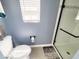 Bright bathroom featuring tile flooring, toilet, and frameless shower with tile surround at 221 Black Bear Rd., Myrtle Beach, SC 29588
