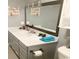 Bathroom featuring a gray vanity, gray walls, and a framed mirror with a modern light fixture at 221 Black Bear Rd., Myrtle Beach, SC 29588