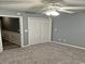 Carpeted bedroom featuring a closet and gray walls, creating a simple and versatile living space at 221 Black Bear Rd., Myrtle Beach, SC 29588