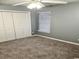 Bedroom featuring neutral paint, plush carpet, window, and closet at 221 Black Bear Rd., Myrtle Beach, SC 29588
