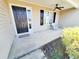 Inviting front porch featuring a seating area, ceiling fan, and a welcoming entrance at 221 Black Bear Rd., Myrtle Beach, SC 29588