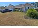 Traditional home with manicured landscaping features healthy lawn, shrubs, and seasonal color at 221 Black Bear Rd., Myrtle Beach, SC 29588