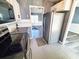 Bright kitchen view features stainless steel appliances and an open view to the living room at 221 Black Bear Rd., Myrtle Beach, SC 29588