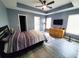 Spacious main bedroom featuring tray ceilings, ceiling fan, dresser, and plank flooring at 221 Black Bear Rd., Myrtle Beach, SC 29588