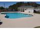 Community pool with cabana surrounded by landscaping, ideal for relaxation and community recreation at 221 Black Bear Rd., Myrtle Beach, SC 29588