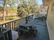 Charming back deck set up with outdoor seating, perfect for enjoying the serene marsh view at 2240 Jackson Circle, Little River, SC 29566
