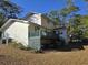 Exterior shot of back of the home with deck overlooking the backyard at 2240 Jackson Circle, Little River, SC 29566