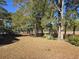 Backyard of the home features a view of marshland and mature trees providing shade and privacy at 2240 Jackson Circle, Little River, SC 29566