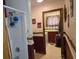 Well-lit bathroom features a shower and a view into the laundry room at 2240 Jackson Circle, Little River, SC 29566