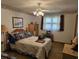 This cozy bedroom is decorated with lighthouse decor and filled with natural light at 2240 Jackson Circle, Little River, SC 29566