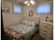 This bedroom has a full bed with light blue seashell bedding, a dresser, and a ceiling fan at 2240 Jackson Circle, Little River, SC 29566