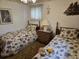 This bedroom has two twin beds, brown carpet, and a collection of lighthouse decor at 2240 Jackson Circle, Little River, SC 29566