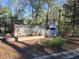 Welcoming entrance sign for Windjammer Village adorned with seasonal decor and lush landscaping at 2240 Jackson Circle, Little River, SC 29566