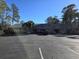 This is a commercial building with a parking lot and landscaping at 2240 Jackson Circle, Little River, SC 29566