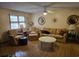 Cozy living room featuring wood floors and traditional furniture with a ceiling fan at 2240 Jackson Circle, Little River, SC 29566