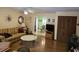 Living room featuring wood floors, traditional furniture, and view into the dining room at 2240 Jackson Circle, Little River, SC 29566