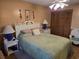 Comfortable main bedroom features a ceiling fan, closet, and coordinating bedside tables with lamps at 2240 Jackson Circle, Little River, SC 29566