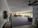 Spacious meeting room featuring ceiling fans, ample seating and natural light, decorated for the Christmas holiday at 2240 Jackson Circle, Little River, SC 29566