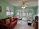 Bright and sunny sunroom with lots of windows offering beautiful views and a comfortable seating arrangement at 2240 Jackson Circle, Little River, SC 29566
