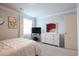 Bedroom featuring a TV on a dresser under a mirror, a window with sheer curtains, and plush carpet at 228 Carolina Lakes Blvd., Myrtle Beach, SC 29588