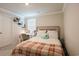 Cozy bedroom showcasing a comfortable bed, a decorative desk and shelf, and a large window at 228 Carolina Lakes Blvd., Myrtle Beach, SC 29588
