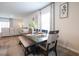 Dining room features a rustic wood table with upholstered chairs and bench seating on a patterned rug at 228 Carolina Lakes Blvd., Myrtle Beach, SC 29588