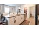 Modern kitchen with island, granite countertops, stainless steel appliances, and pantry at 228 Carolina Lakes Blvd., Myrtle Beach, SC 29588