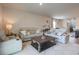 Spacious living room with neutral colors, plush seating, and a decorative coffee table at 228 Carolina Lakes Blvd., Myrtle Beach, SC 29588