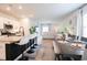 Open living space with kitchen island, dining area and living room allowing for easy entertaining and gathering at 228 Carolina Lakes Blvd., Myrtle Beach, SC 29588