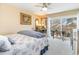 Cozy bedroom with ceiling fan, water view, and private balcony access at 276 Salt Marsh Circle # 4D, Pawleys Island, SC 29585