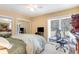 Bedroom featuring a queen bed, workstation, large window, and double closet at 276 Salt Marsh Circle # 4D, Pawleys Island, SC 29585