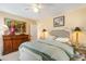 Bedroom featuring a queen bed, ceiling fan, and decorative items at 276 Salt Marsh Circle # 4D, Pawleys Island, SC 29585